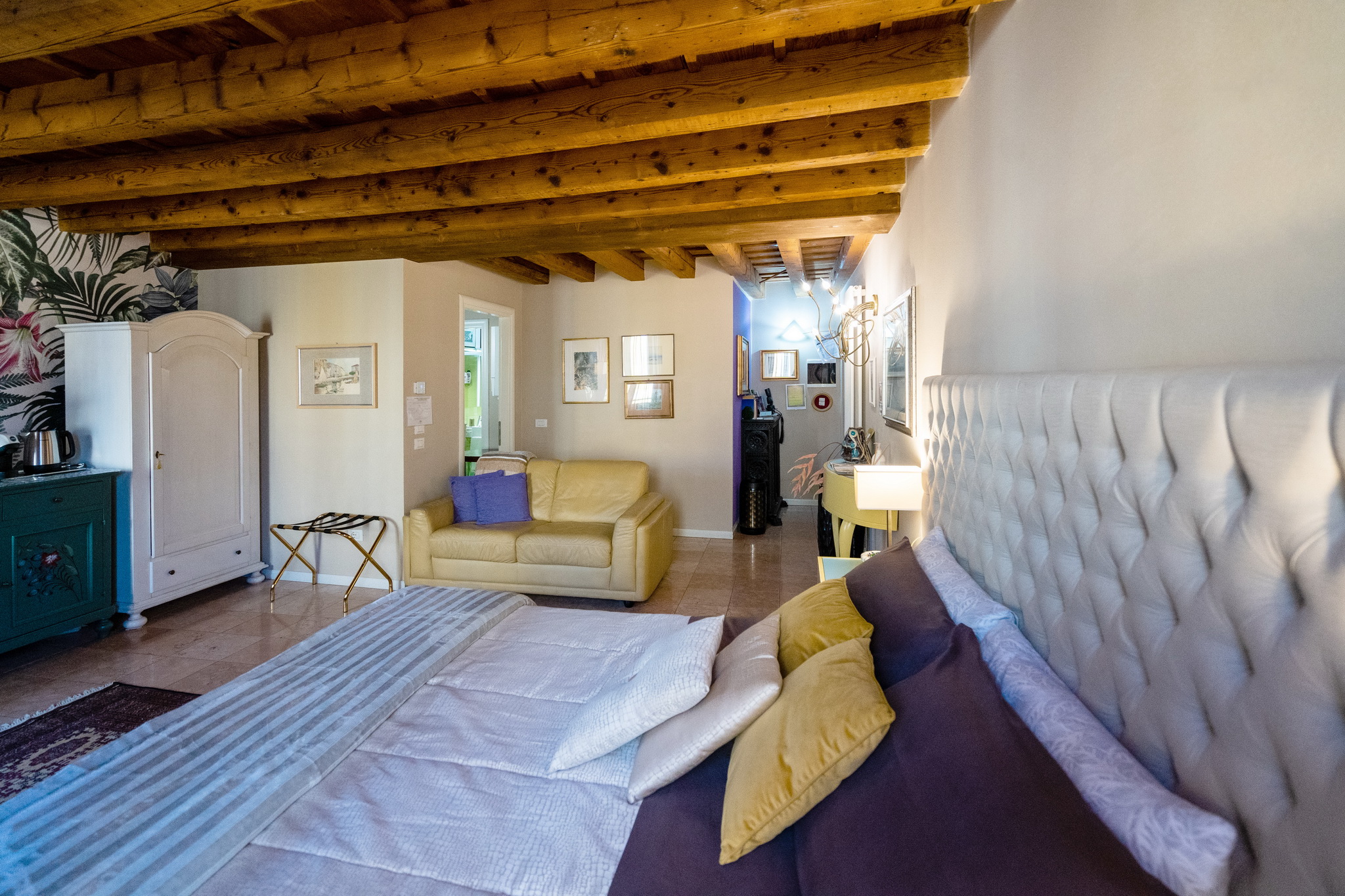 a picture about the room, bed and coach